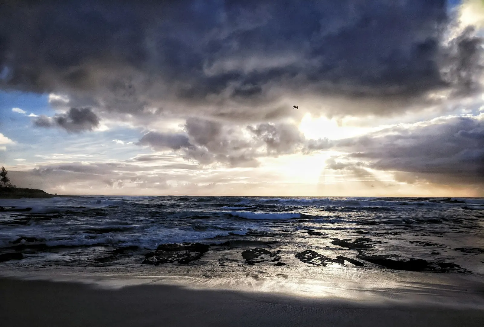 Sunset over the water at La Jolla Cove